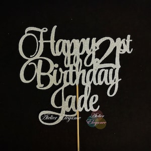 May include: Silver glitter cake topper with the text "Happy 21st Birthday Jade".
