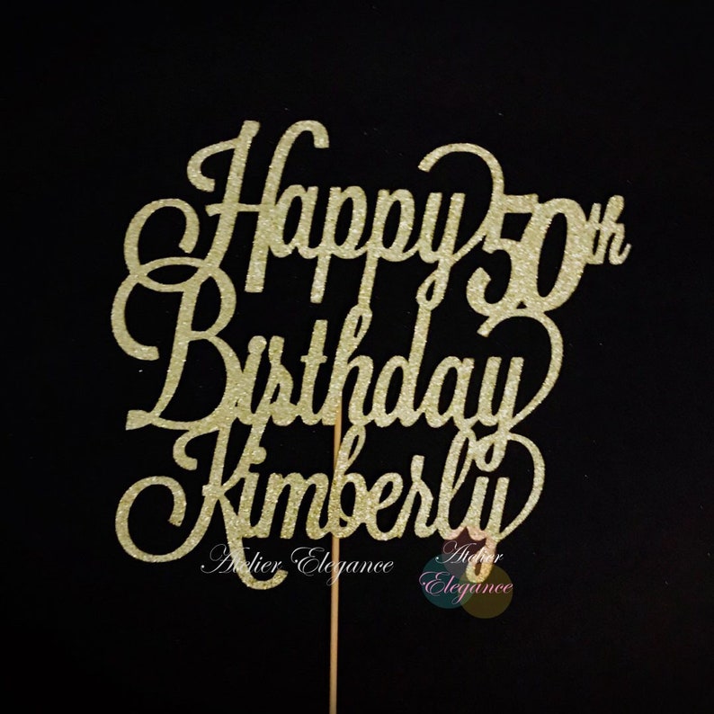May include: Gold glitter cake topper with the text "Happy 50th Birthday Kimberly".