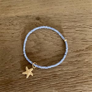 Pearl bracelet blue white striped gold with starfish