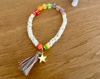 Pulsera MISS YOU color blanco con borla y estrella dorada