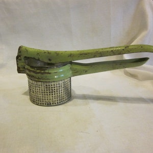 Vintage metal  ricer with green enameled handle vintage potato ricer chippy farmhouse kitchen decor potato masher