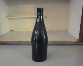 Vintage brown blown glass bottle round bottle  medicinal or beer bottle?