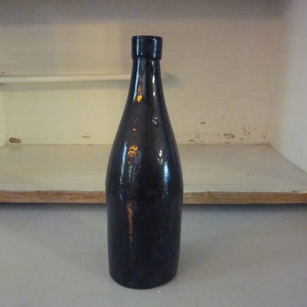 Vintage brown blown glass bottle round bottle  medicinal or beer bottle?