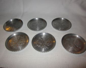 Six vintage aluminum coasters - floral pattern