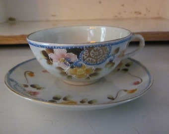 Nippon teacup hand painted with raised embellishments blue pink yellow floral gilt detail vintage Nippon
