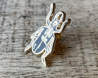 Metamorphosis - Enamel Pin Badge - Skeleton Beetle Design