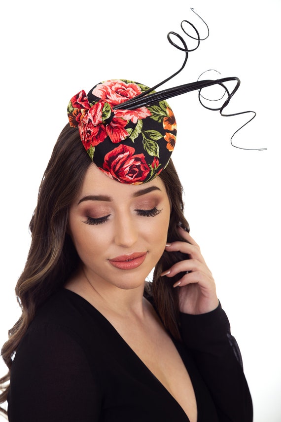 red and black hats and fascinators