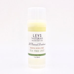 May include: A white plastic deodorant stick with a green label that reads "LEVS NATURALS ORGANIC SKIN CARE All Natural Deodorant BAKING SODA FREE TEA TREE ZEST 2 oz (60ml)"
