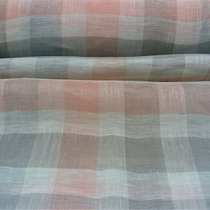 100% Scandinavian Linen Voile Fabric Sold By Metre or 20m Piece. A Peach and light grey check. Cut Fabric is NON Returnable.