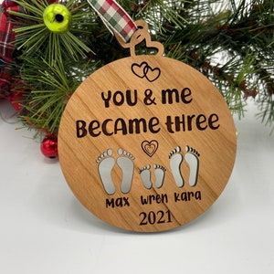 You and me became three. custom new baby ornament 2024. first baby ornament. First baby ornament. Family ornament. new mom and dad ornament. image 5