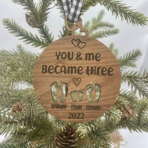 You and me became three. custom new baby ornament 2024. first baby ornament. First baby ornament. Family ornament. new mom and dad ornament. image 2
