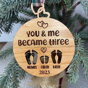 You and me became three. custom new baby ornament 2024. first baby ornament. First baby ornament. Family ornament. new mom and dad ornament.