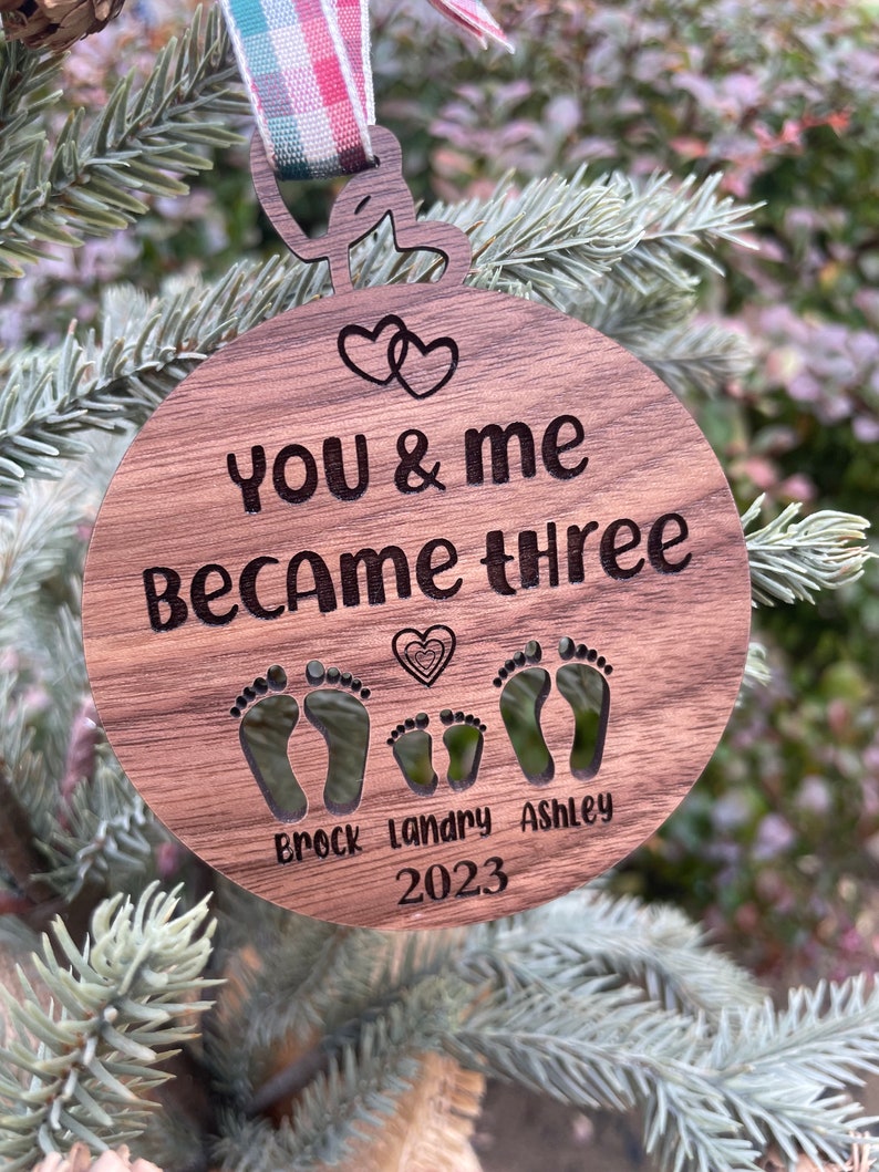 You and me became three. custom new baby ornament 2024. first baby ornament. First baby ornament. Family ornament. new mom and dad ornament. image 3