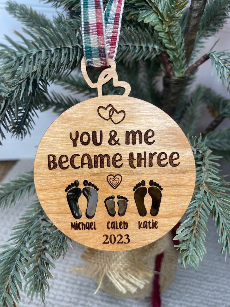 You and me became three. custom new baby ornament 2024. first baby ornament. First baby ornament. Family ornament. new mom and dad ornament. image 1