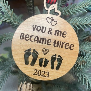 You and me became three. baby ornament 2024. new baby ornament. first baby ornament. Family ornament. new mom and dad ornament.wood ornament