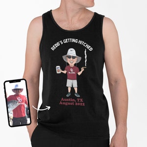 May include: Black tank top with a cartoon illustration of a man wearing a white hat, sunglasses, and a red shirt with the word "Oklahoma" on it. The man is holding a can of beer and a cigar. The text "Redd's Getting Hitched" is above the illustration, and the text "Austin, TX August 2022" is below the illustration.