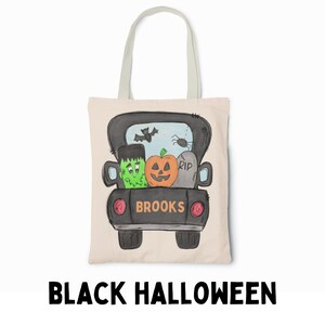 May include: A black Halloween tote bag with a cartoon truck carrying a pumpkin, a Frankenstein monster, and a tombstone that says "RIP". The truck has the word "BROOKS" written on the back.
