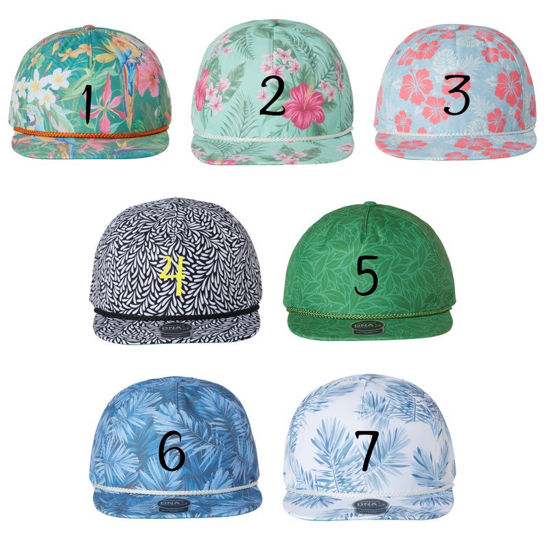 May include: Seven different patterned baseball caps with numbers 1 through 7 embroidered on the front. The caps are in various colors and patterns, including green, blue, pink, and white.