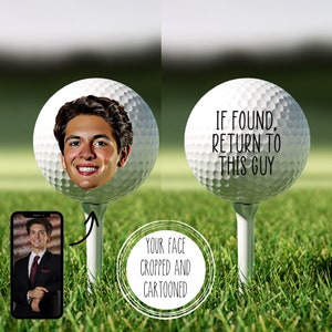 Peut inclure: Une balle de golf blanche avec un visage de dessin anim&eacute; dessus. Le texte "IF FOUND, RETURN TO THIS GUY" est imprim&eacute; sur l'autre balle de golf.