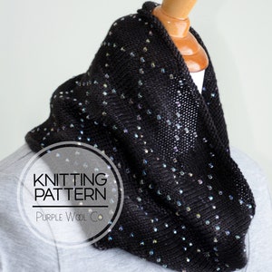 May include: Knitting pattern for a black cowl with iridescent beads. The pattern is called "Purple Wool Co."
