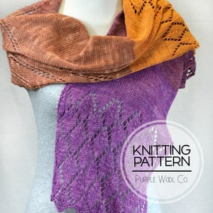 May include: A purple, brown, and orange knitted shawl with a lacy pattern. The shawl is draped over a mannequin. The text "Knitting Pattern Purple Wool Co." is visible in a circle.
