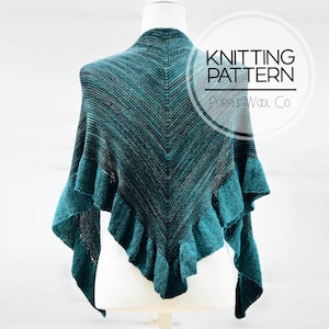 May include: A teal and gray knitted shawl with a ruffled edge is displayed on a mannequin. The shawl has a chevron pattern and is labeled "Knitting Pattern" by Purple Wool Co.