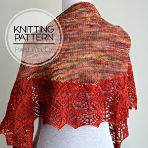 May include: A red and brown knitted shawl with a lace border. The shawl is draped over a mannequin. The text "Knitting Pattern Purple Wool Co." is visible in a circle.