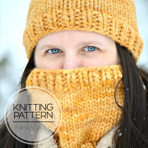 May include: A knitting pattern for a yellow beanie and neck warmer. The pattern is called "Purple Wool Co."