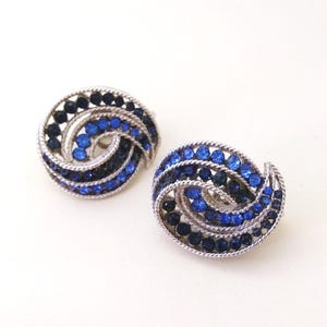 Crown Trifari Cavalcade Earrings blue rhinestone swirl silver tone vintage