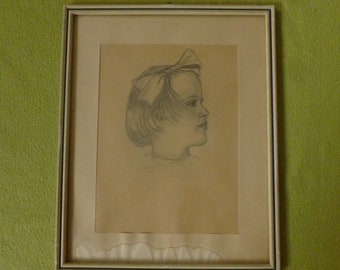 May include: A framed pencil drawing of a young girl with a large bow in her hair. The girl is looking to the right and her hair is pulled back from her face. The drawing is on a light brown paper and is framed in a simple wooden frame.