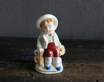 IMPORTAR figura de niño de porcelana