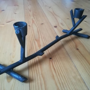 Iron candle holder.