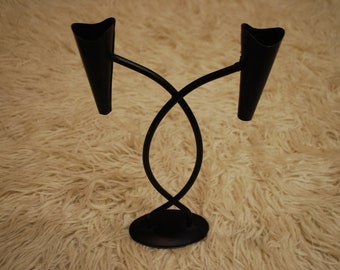 Iron candle holder.