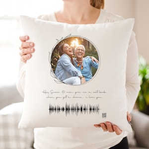 May include: White throw pillow featuring a black and white photograph of two women smiling. The text "Hey Susan, It's mom give me a call back when you get a chance... I love you" is printed below the photo. A black and white audio waveform is printed below the text.