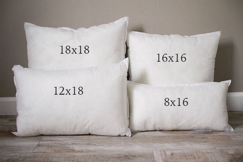 May include: Four white pillow inserts of different sizes. The largest pillow is 18x18 inches, the next largest is 16x16 inches, the next is 12x18 inches, and the smallest is 8x16 inches.