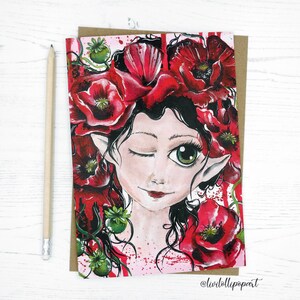 May include: A whimsical illustration of a fairy with a crown of red poppies. The fairy has green eyes, a winking expression, and pointy ears. The background is a pink and white splatter pattern.