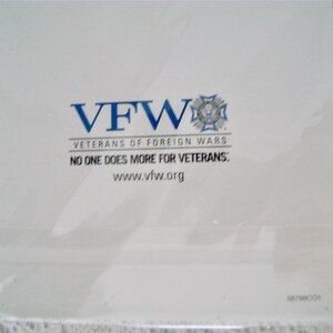 May include: White card with the blue text "VFW" and the words "Veterans of Foreign Wars". Below the text is the phrase "NO ONE DOES MORE FOR VETERANS:" and the website address www.vfw.org.