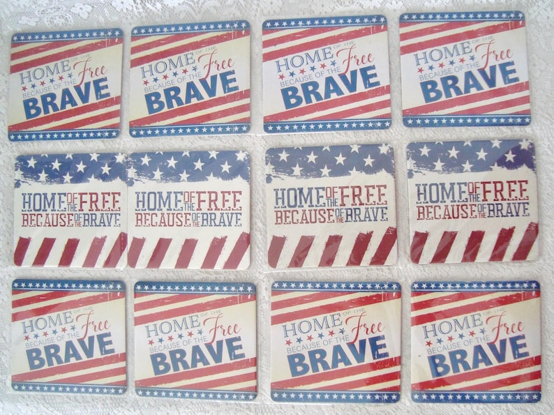 May include: A collection of patriotic-themed coasters. Each coaster features a design with red and white stripes, blue stars, and the phrases "HOME OF THE FREE BECAUSE OF THE BRAVE" or "HOME Free BRAVE".