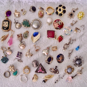 May include: A set of three ceramic mugs with a speckled, matte finish. The mugs are in shades of cream, light gray, and dark gray. Each mug has a simple, minimalist design, perfect for coffee or tea.