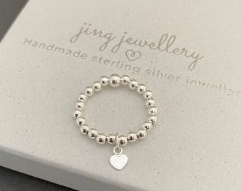 Sterling silver beaded stretch stacking ring with mini heart charm, Handmade elastic rings, Any size available, gift idea.