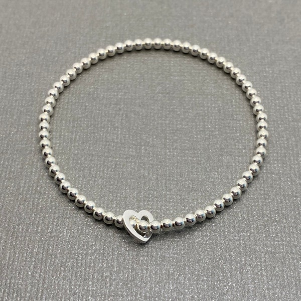 Sterling Silver beaded stretch bracelet with floating heart, Handmade stacking bracelet, Heart bead bracelet, heart elastic bracelet for her