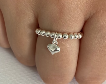 Sterling silver beaded stretch stacking ring with mini puffed heart charm, Handmade elastic rings, Any size available, gift idea.