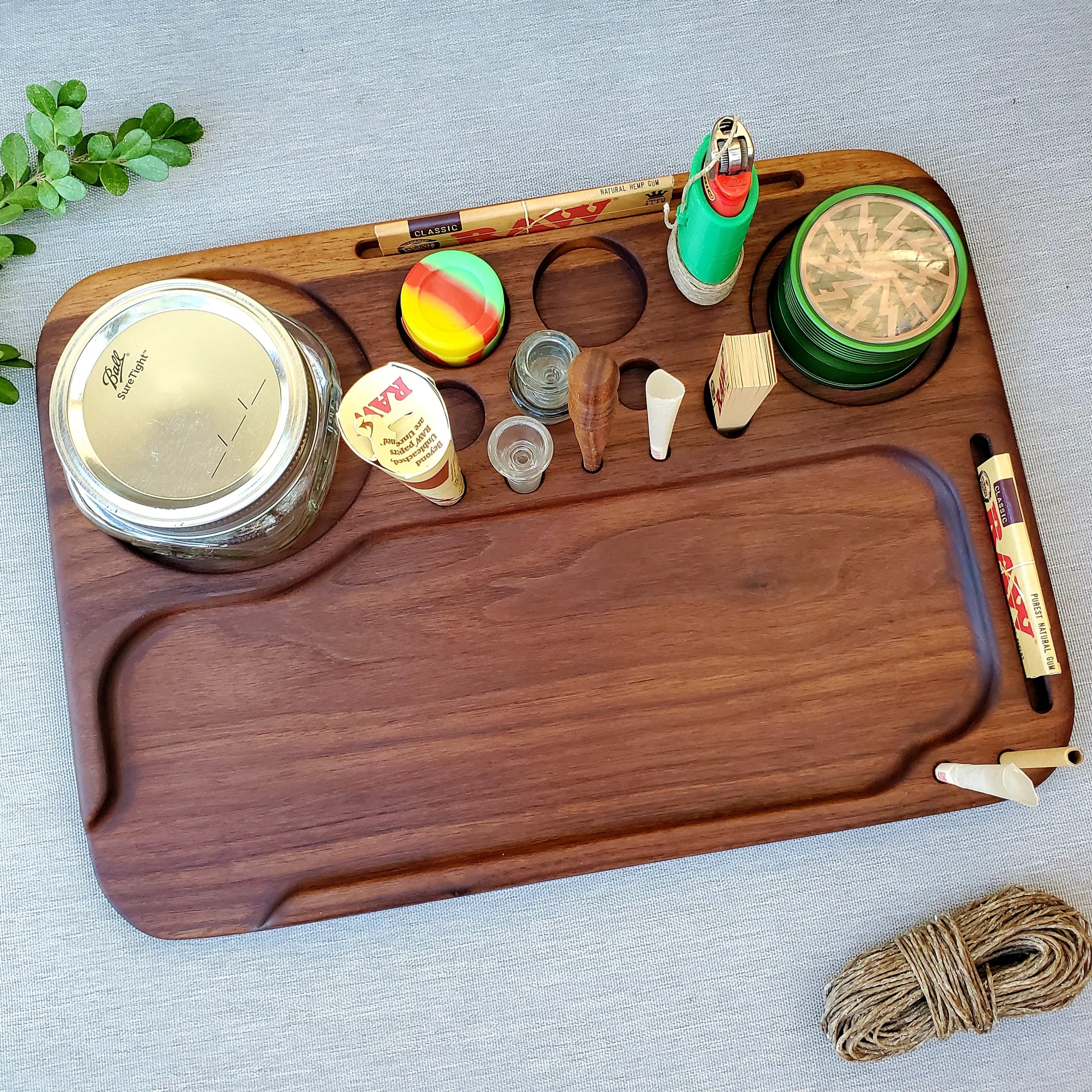 100 Pre-Rolled Cones, a 4 part metal grinder and a Wooden Rolling Tray Set