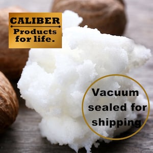 May include: Close-up of white shea butter with a textured appearance, alongside two brown shea nuts. The image includes the text "CALIBER Products for life."