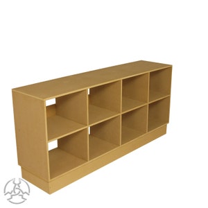 May include: A light brown wooden shelf unit with nine open cubbies. The shelf has a base and is made of unfinished wood.
