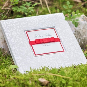 White wedding guest book with personalized text, perfect wedding gift