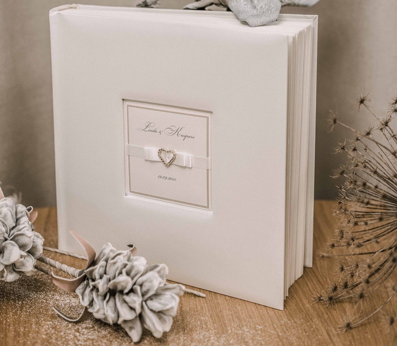 Large ivory color wedding photo album with personalization capacity up to 720 pictures sized 4 x 6.