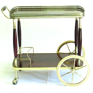 Neoclassical style bar cart mahogany and brass. Hollywood Regency French mahagony drinks trolley in the manner of Maison Jansen, (Bagués),