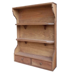 May include: A wooden wall shelf with two drawers and three shelves. The shelf is made of natural wood and has a rustic look.