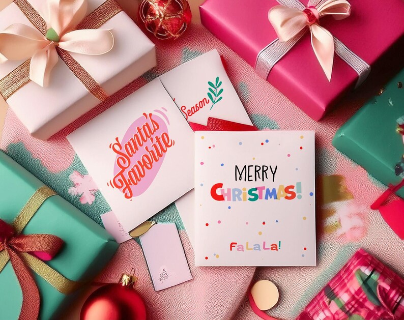 May include: An overhead shot of wrapped gifts and greeting cards. The gifts are in white, pink, and teal, with matching ribbons. The cards read "Santa's Favorite" and "Merry Christmas!" with colorful confetti.